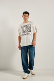 Camiseta oversize crema clara con diseños de Keith Haring