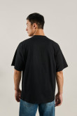 Camiseta manga corta negra oversize y diseño de Keith Haring
