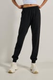 Pantalón jogger negro ajustado con botas en rib