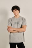 Camiseta manga corta oversize unicolor con texto college