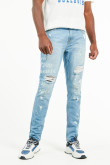 Jean skinny tiro bajo azul claro con rotos y estampados