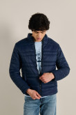 Chaqueta azul intensa acolchada con cremallera y cuello alto