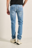 Jean azul claro skinny tiro bajo con bolsillos y desgastes