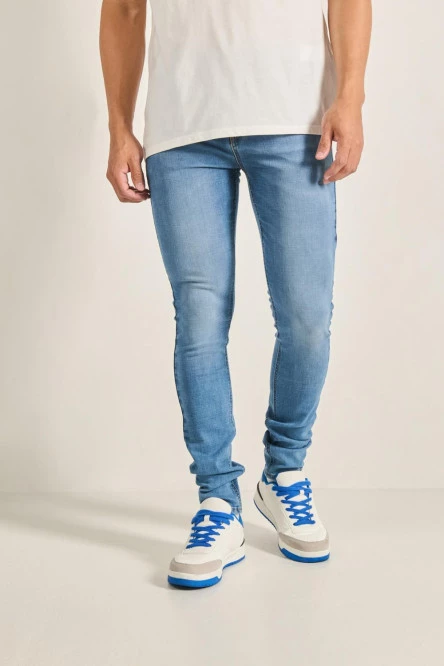 Jean súper skinny azul claro ceñido tiro bajo con desgastes