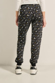 Pantalón jogger negro con bolsillos y diseños de Snoopy