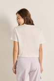 Camiseta crema clara crop top con diseño racer en frente