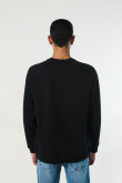 Buzo negro oversize cuello redondo con manga ranglan