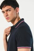 Camiseta unicolor polo con tejido en puños y cuello