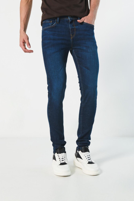 Jean ajustado skinny azul oscuro tiro bajo con 5 bolsillos