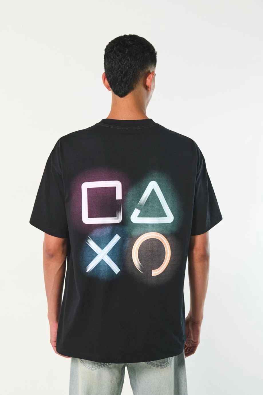 Camiseta negra de PlayStation oversize con cuello redondo