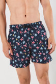 Bermuda playera azul intensa con diseños de estrellas de mar