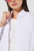 Blusa manga larga unicolor con botones y cuello camisero