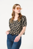 Blusa unicolor crop top estampada con cuello V