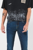 Jean skinny azul oscuro ajustado con bolsillos y tiro bajo