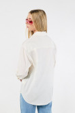 Blusa manga larga unicolor oversize con cuello camisero