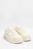 Tenis casuales blancos con suela alta y contrastes