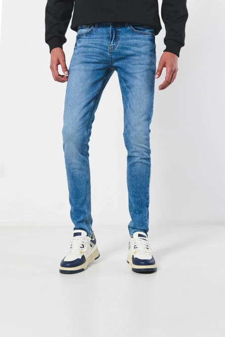 Jean skinny tiro bajo azul con ajuste ceñido y bolsillos