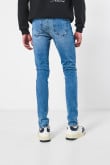 Jean skinny tiro bajo azul con ajuste ceñido y bolsillos