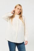 Blusa unicolor oversize con manga larga y botones