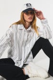 Blusa oversize unicolor a rayas con manga larga