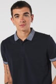 Camiseta unicolor polo con puños y cuello en contraste