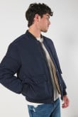 Chaqueta bomber unicolor acolchada doble faz con bolsillos con tapa