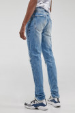 Jean azul claro skinny con diseño de rotos y parches