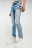 Jean azul medio tipo skinny con rotos y detalles en láser