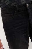 Jean slim tiro bajo negro con bolsillos clásicos y ajuste ceñido