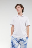 Camiseta polo unicolor con cuello y puños tejidos