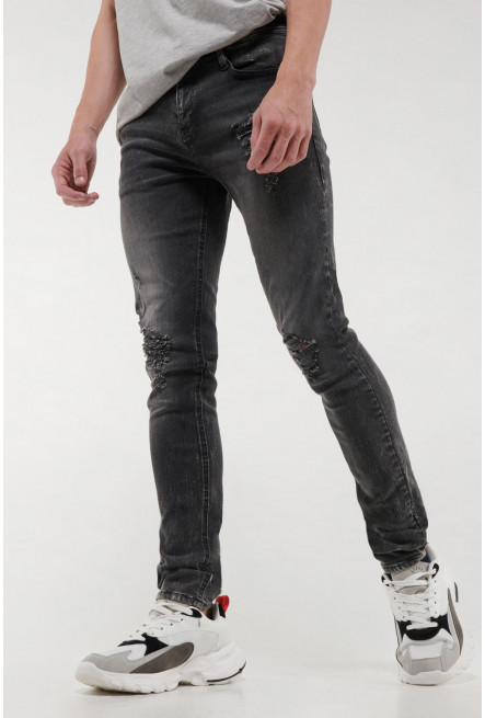 Jean súper skinny gris oscuro con rotos delanteros y desgastes de color