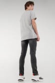 Jean súper skinny gris oscuro con rotos delanteros y desgastes de color