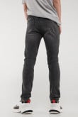 Jean súper skinny gris oscuro con rotos delanteros y desgastes de color