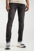 Jean skinny negro con tiro bajo y roto en pierna derecha