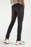 Jean skinny negro con tiro bajo y roto en pierna derecha